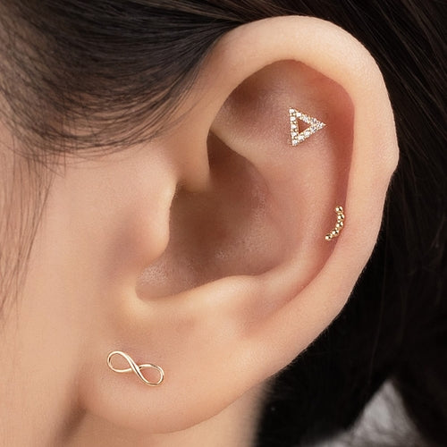 Solid gold infinity piercing
