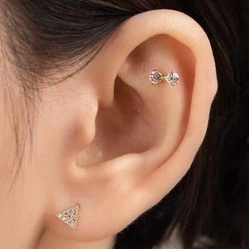 Solid gold cubic bow piercing