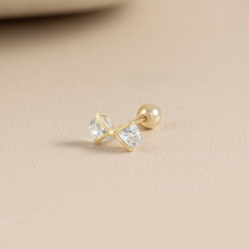 Solid gold cubic bow piercing